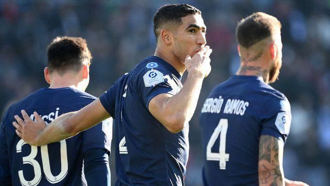 Achraf Hakimi celebrates with teammates after scoring for PSG in 5-0 win over Auxerre