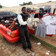 A man selling clothes from his car in Zimbabwe