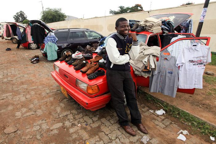 A man selling clothes from his car in Zimbabwe