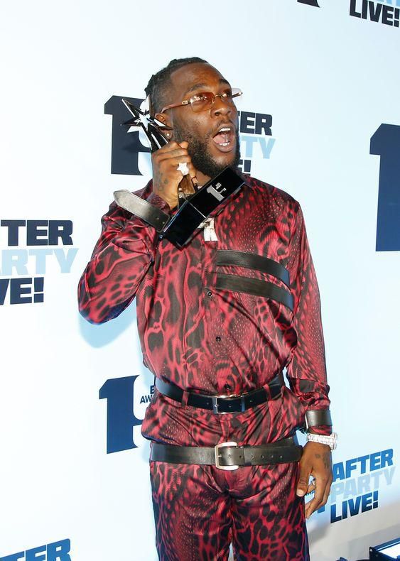 Burna Boy wearing two belts {pinterest}