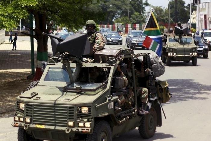 Military vehicles lead the way as South African President Jacob Zuma arrives as the head of an Africa Union-lead delegation in an attempt to broker dialogue to end months of violence in Burundi's capital Bujumbura February 25, 2016. REUTERS/Evrard Ngen...