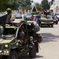 Military vehicles lead the way as South African President Jacob Zuma arrives as the head of an Africa Union-lead delegation in an attempt to broker dialogue to end months of violence in Burundi's capital Bujumbura February 25, 2016. REUTERS/Evrard Ngen...