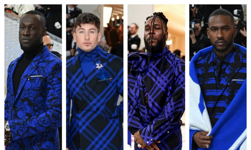 Burna Boy and others in similar Burberry outfits [Getty]
