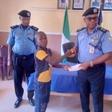 L-R: L-R: One of the deceased police officers’ children receiving a cheque from Kebbi Police Commissioner, CP Chris Aimionowane, in Birnin Kebbi on Thursday [NAN]