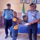 L-R: L-R: One of the deceased police officers’ children receiving a cheque from Kebbi Police Commissioner, CP Chris Aimionowane, in Birnin Kebbi on Thursday [NAN]