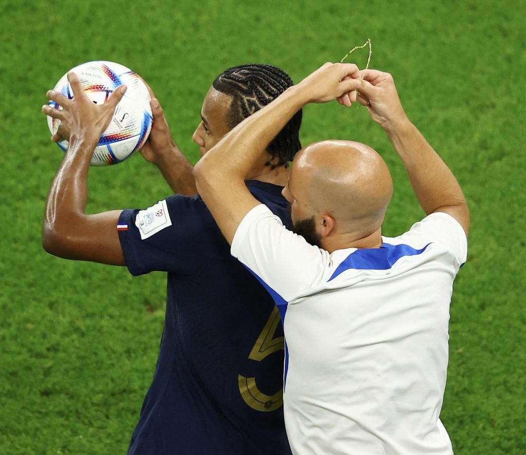 Kounde wore a chain in the game between France and Poland