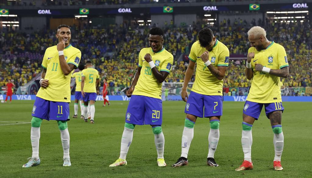 Vinicius Junior (2-L) of Brazil celebrates after scoring during the FIFA World Cup match on December 5, 2022.