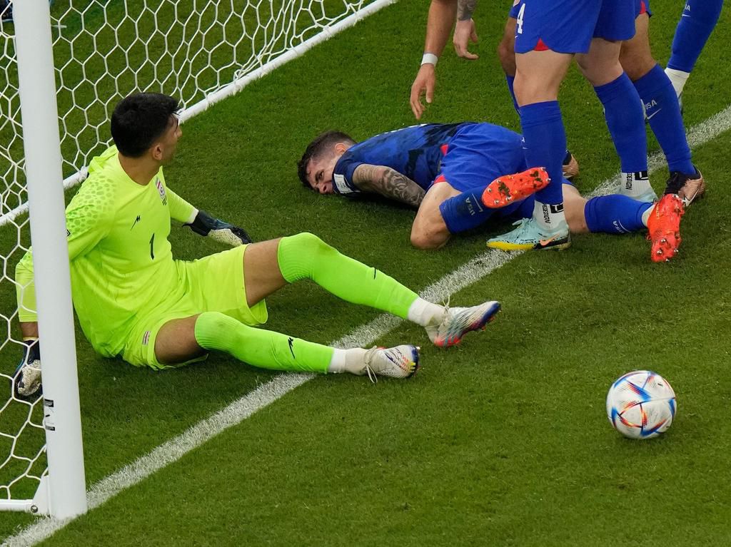 Christian Pulisic suffers on the ground after scoring against Iran at the World Cup.AP Photo/Luca Bruno