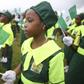 female student holding the nigerian flag at past indepence day celebration
