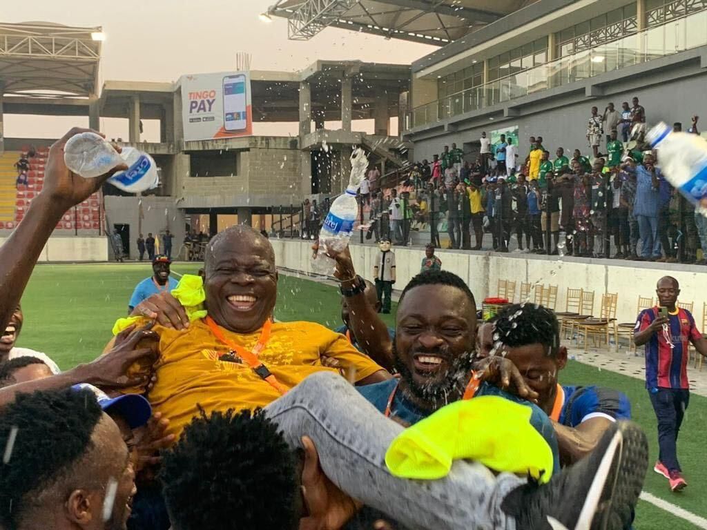 Gbenga Ogunbote lifted up by his players and coaching crew after the win.