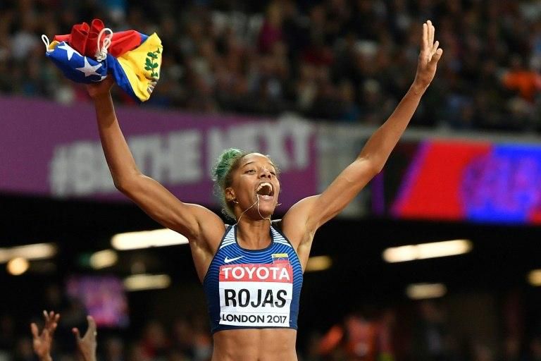 Venezuela's Yulimar Rojas celebrates her victory in the final of the women's triple jump at the 2017 IAAF World Championships in London on August 7, 2017