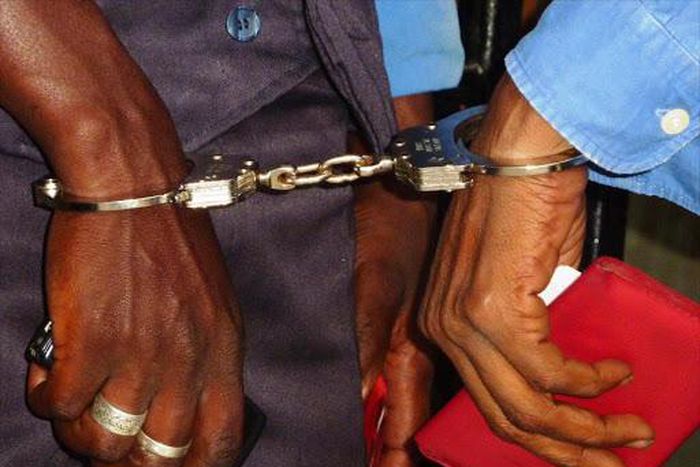 Suspects handcuffed together