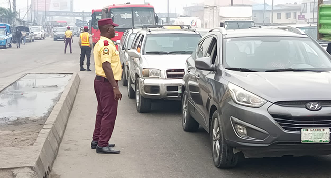 LASTMA officials in Lagos control traffic and arrest defaulting motorists. [Channels TV]