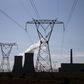 Electricity pylons are seen near Arnot Power Station's cooling towers, east of Middelburg in Mpumalanga province, September 8 2015.   REUTERS/Siphiwe Sibeko