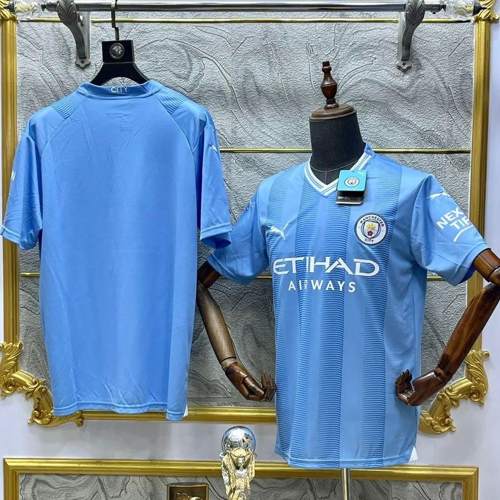 Manchester City jerseys for sale on display