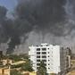 Smoke billows above residential buildings in Khartoum on as fighting in Sudan raged for a second day on April 16.Source: AFP/Getty Images.