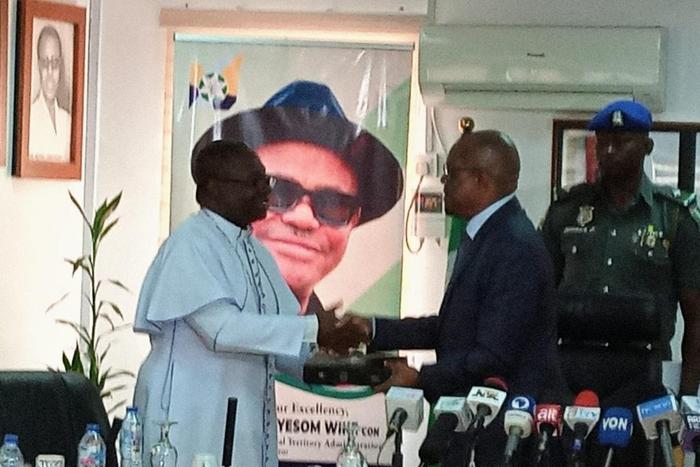 CAN National President, Most Rev. Daniel Okoh in a handshake with FCT Minister, Nyesom Wike in Abuja on Wednesday [NAN]