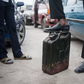 A man waits with his jerrican to buy fuel in Lagos (image used for illustration) [Stefan Heunis/AFP]