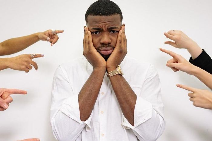 A man holding his face [Image credit: Yan Krukau]