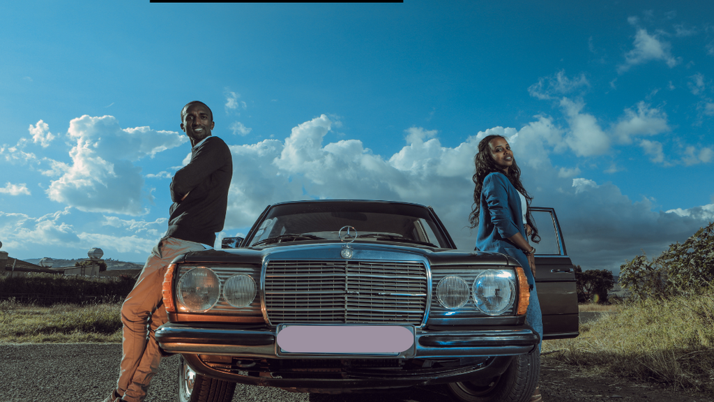 A couple beside their car
