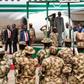 President Muhammadu Buhari with the troops of the Nigerian Army fighting Boko Haram terrorists in Borno [Prof Zulum]