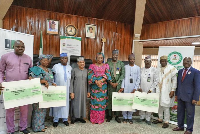 The Head of the Civil Service, Dr Folasade Yemi-Esan, the partners and the beneficiaries of BOA Agriculture Credit Facility during the symbolic presentation of cheques on Thursday in Abuja [NAN]
