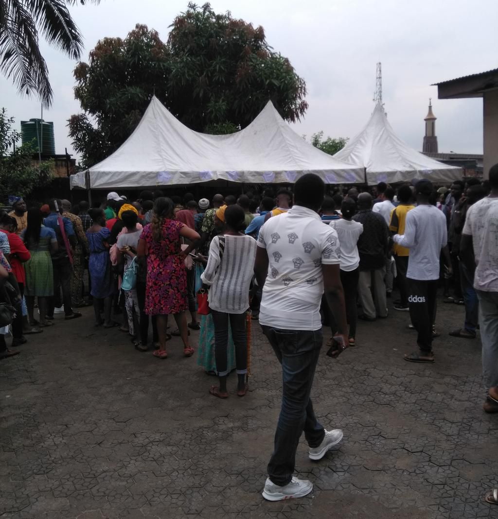 Nigerians queue at the Independent National Electoral Commission (INEC) office in Surulere, Lagos State to collect their permanent voters' cards (PVC)