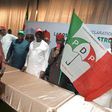 Gov. Ifeanyi Okowa, PDP Vice Presidential Candidate handling over party’s flag to the ADC defectors in Lagos on Sunday