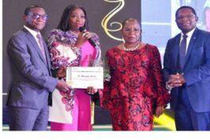 L-R; Lamin Barrow AfDB Nigeria received the award on behalf of Adesina (Credit: NAN)