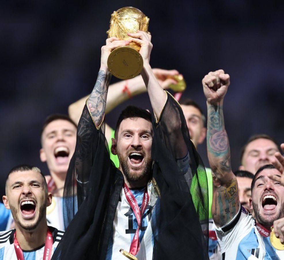 Messi lifts the FIFA World Cup.