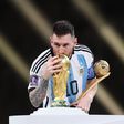 Lionel Messi with the World Cup trophy and his golden ball after leading Argentina to victory against France in the final in Qatar