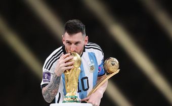 Lionel Messi with the World Cup trophy and his golden ball after leading Argentina to victory against France in the final in Qatar