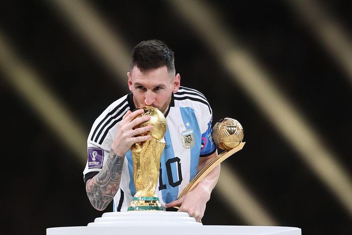 Lionel Messi with the World Cup trophy and his golden ball after leading Argentina to victory against France in the final in Qatar