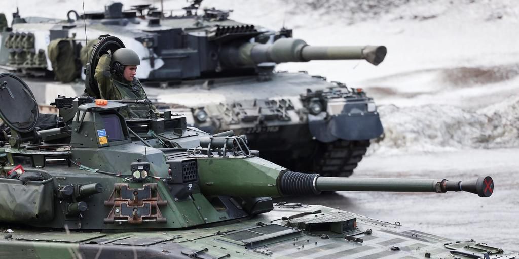 Swedish and Finnish tanks during a military exercise called "Cold Response 2022," which gathered around 30,000 troops from NATO member countries plus Finland and Sweden in Evenes, Norway, March 22, 2022.REUTERS/Yves Herman