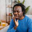 Man complaining of a tooth ache