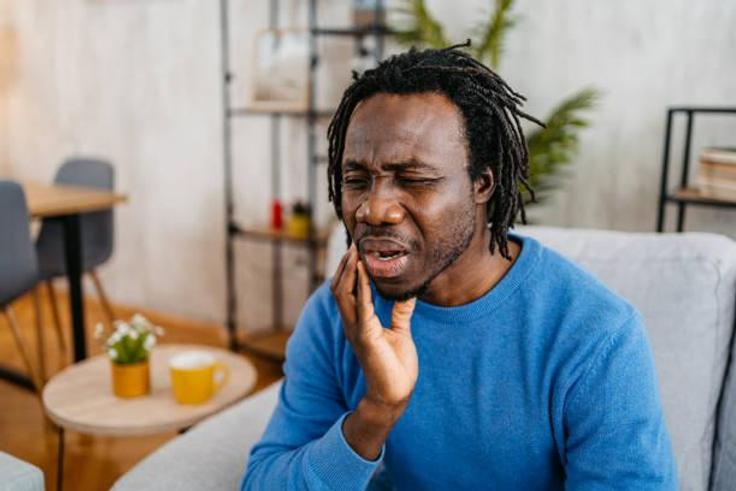 Man complaining of a tooth ache