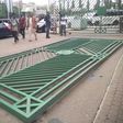 The National Assembly gate pulled down by protesters. [Punch]