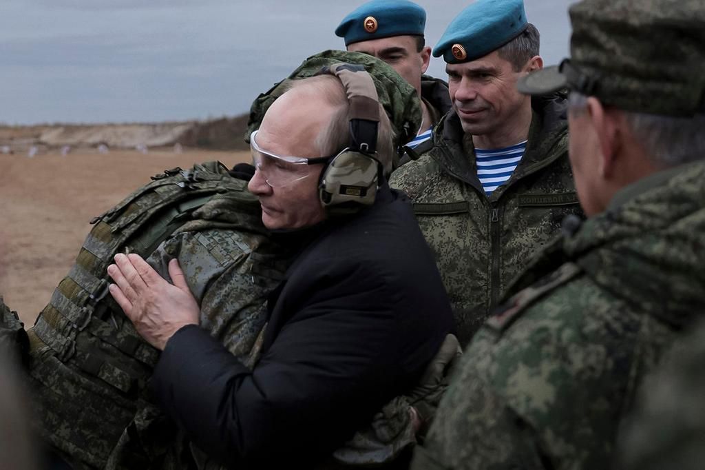 Russian President Vladimir Putin embraces a soldier as he visits a military training center for mobilized reservists in Ryazan, Russia, October 20, 2022.Russian Defense Ministry Press Service via AP