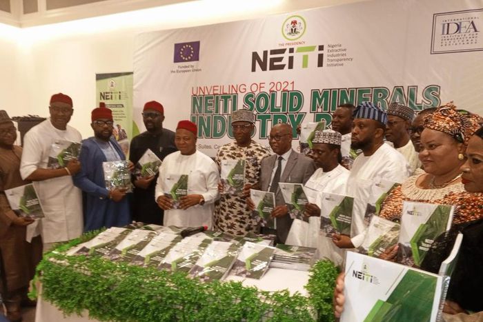 Dr Maurice Mbaeri, Permanent Secretary, General Services Office, SGF (5th left), Dr Orji Ogbonnaya Orji, Executive Secretary NEITI (5th right) with National assembly members CSOs, development partners at the unveiling of 2021 solid minerals reports in ...