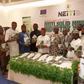 Dr Maurice Mbaeri, Permanent Secretary, General Services Office, SGF (5th left), Dr Orji Ogbonnaya Orji, Executive Secretary NEITI (5th right) with National assembly members CSOs, development partners at the unveiling of 2021 solid minerals reports in ...