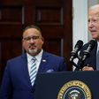 U.S. President Joe Biden is joined by Education Secretary Miguel Cardona (L).Chip Somodevilla/Getty Images