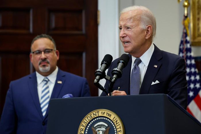 U.S. President Joe Biden is joined by Education Secretary Miguel Cardona (L).Chip Somodevilla/Getty Images