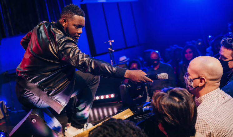 Ayodeji "AY" Makun during the performance of AY: Spotting the Difference [Instagram/@aycomedian]