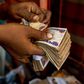 Counting ₦50,000 Naira [Bloomberg]