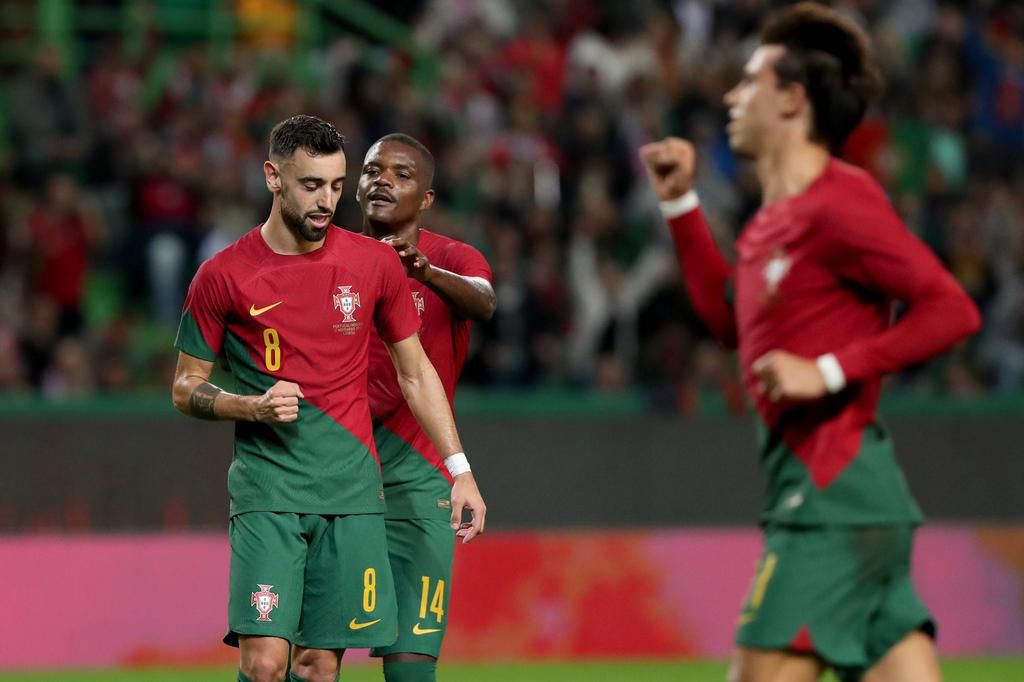 Bruno Fernandes (L) of Portugal celebrates with teammates after scoring during an International friendly against Nigeria on November 17, 2022.