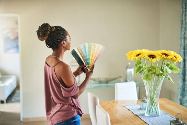 A woman looking for colours to paint her house