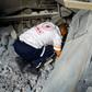 A man works to remove causalities from under the rubble in the aftermath of Israeli strikes, in Khan Yunis, southern Gaza Strip.REUTERS/Ibraheem Abu Mustafa