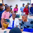 Behind: Lagos State Governor, Mr Babajide Sanwo-Olu (third right); Senator Adetokunbo Abiru (second right); his wife/Co-founder of the SAIL (Senator Abiru Innovation Lab), Mrs Feyisola Abiru (third left), taking a selfie with some students during the o...