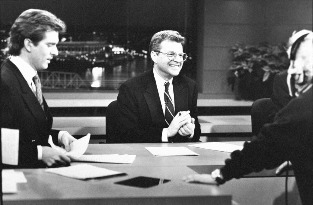 Jerry Springer chatting with co-anchor Jim Watkins and a technician before a news broadcast at WLWT-TV.Steve Kagan/Getty Images