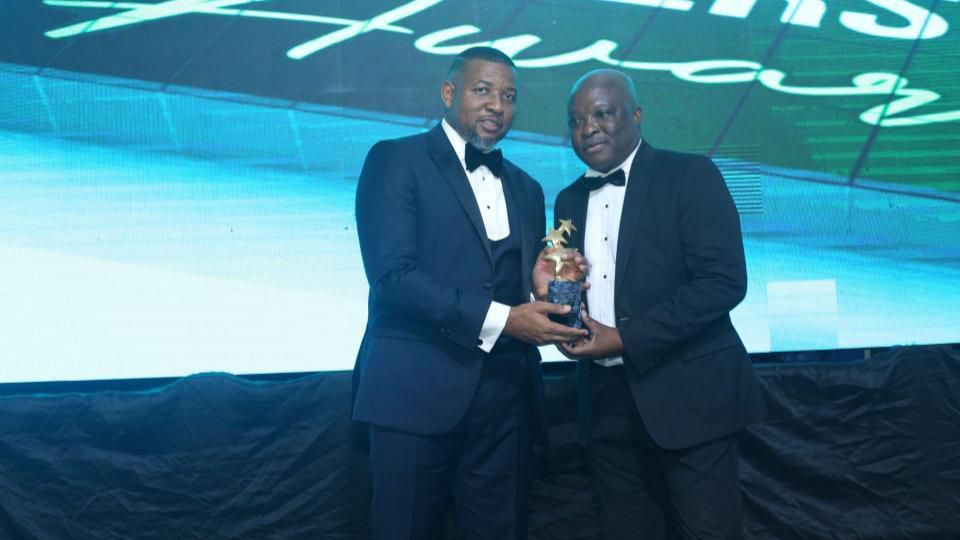 City Sports CEO Shola Opaleye (left) presenting an award to the Chairman Lagos State Sports Commission, Sola Aiyepeku (right)